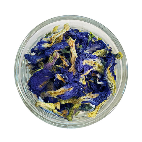 small jar with butterfly pea flowers