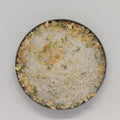 Small round dish of Gilroy Garlic Pacific Sea Salt.