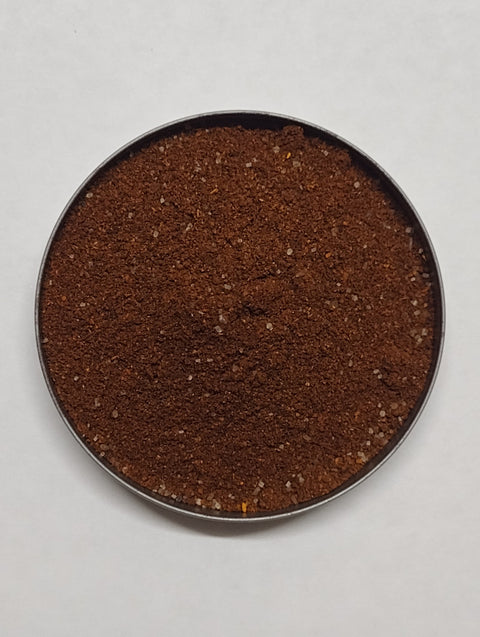 small round dish of Mexican Mole Seasoning loose spice