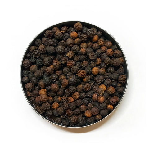 Round dish with Organic Black Peppercorns
