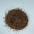 over head view of a loose pile of Black Garlic Salt