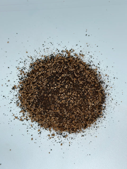 over head view of a loose pile of Black Garlic Salt