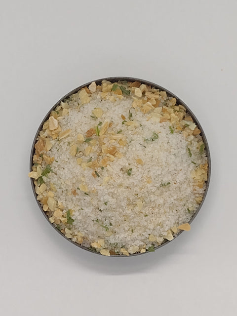 Small round dish of Gilroy Garlic Pacific Sea Salt.