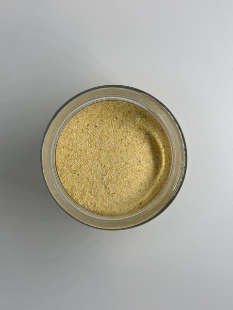 Small dish with loose pile of Granulated Garlic