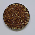small round dish of Honey Lavender Spice loose leaf tea.
