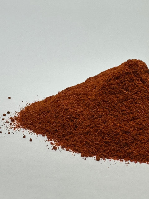 loose pile of the spanish smoked hot paprika spice.